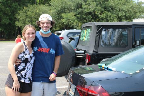 Seniors Ty Schneider and Emma Mixon decorate their cars on the eve of their last first day.